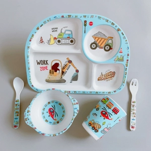 Close-up of bamboo fiber kids tableware set with cartoon construction vehicle patterns