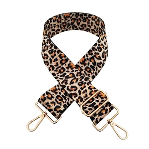 Close-up of leopard print replacement bag strap with golden metal swivel hooks