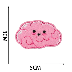Close-up of pink cloud cartoon embroidery patch with 5cm x 3cm size measurements