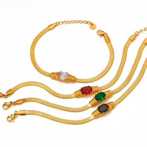 Detail of gold stainless steel snake chains with colorful oval stones and extender chains