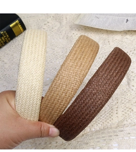 Detail showing the intricate V-shaped woven texture of cotton-linen wide headbands