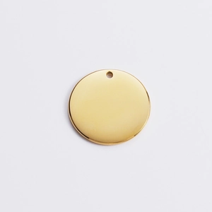 Flat lay of a 18k gold plated stainless steel round tag pendant with top hole for DIY jewelry