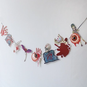 Detail of Halloween banner showing bloody handprints, skulls, and bats on white background
