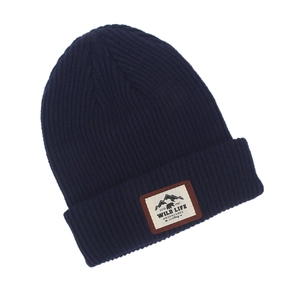 Detail of navy knit beanie with mountain and bear patch showing wild life adventures