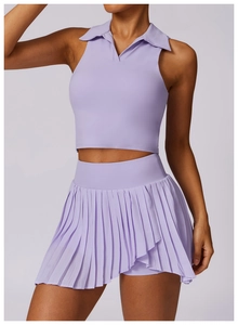 Pale purple two-piece athletic set featuring a sleeveless polo top and pleated tennis skirt