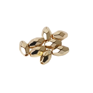 Set of eight golden geometric faceted metal beads for DIY jewelry making projects