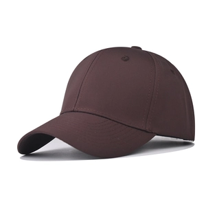Close-up of a deep brown six-panel baseball cap with curved brim and breathable eyelets