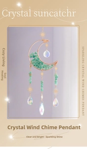 Detailed suncatcher view with golden moon frame, green stones and crystal prisms