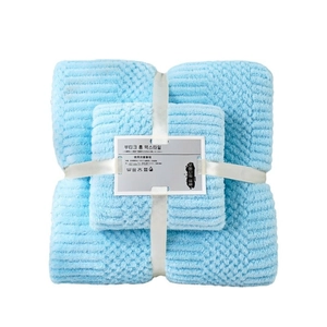 Blue coral fleece towel set with striped texture and elegant ribbon gift packaging