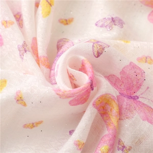 White linen-feel scarf with pink butterfly prints and sparkling gold powder accents