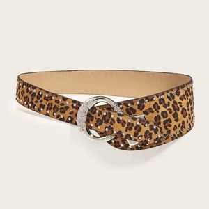 Punk style leopard print belt with silver studs and engraved buckle on beige background