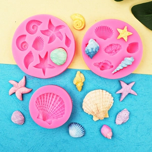 Pink silicone starfish and seashell molds for ocean themed fondant cake decorations