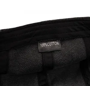 Detailed macro view of 100% cotton wash label and inner stitching on denim flat cap