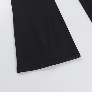 Detail of wide leg hem with premium stitching on black sexy halter lace jumpsuit