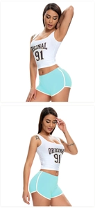 Detail of white and mint green yoga set with high-elastic fabric and letter print