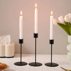 Modern black iron candlestick set for elegant dining table decor and home atmosphere