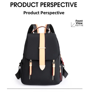 Front detail of black Oxford fabric backpack with beige and red contrast straps and buckles