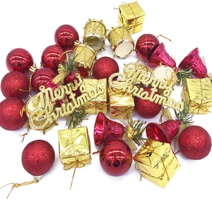 32-piece Christmas tree ornament set including red balls, gold bells, and gift boxes
