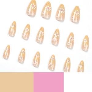 Pink polka dot and daisy flower press-on nails with long almond shape on white base