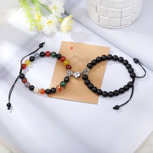 Detail of natural tiger eye stone beads and heart-shaped magnetic clasp on adjustable bracelets