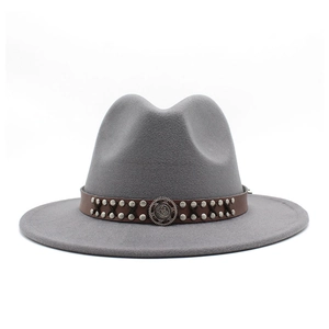 Detailed view of light gray wool fedora hat with brown leather studded band and buckle