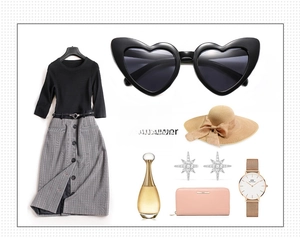 Flat lay of heart-shaped sunglasses with stylish outfit and elegant accessories