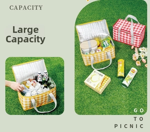 Detail of insulated picnic basket with red plaid pattern and silver aluminum foil lining