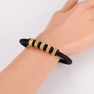 Men's punk leather bracelet with black braided cord and engraved gold metal accents