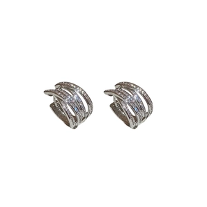 Crossed multi-layer silver earrings with shimmering white zircons for a luxury look