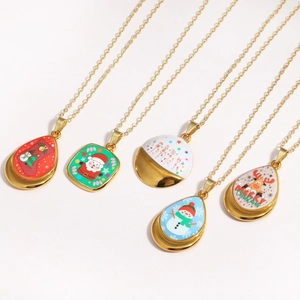 Detail of five gold necklaces featuring colorful Christmas enamel charms in various shapes