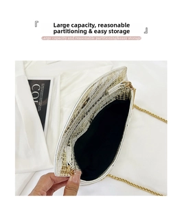 Detail view of the white crocodile pattern handbag showing spacious interior compartment