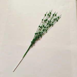 Detailed view of artificial bright green glitter berry stems for Christmas tree decoration