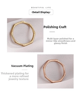Detailed view of bamboo-style rings in gold and rose gold finishes with mirror polishing