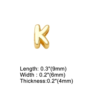 Macro shot of gold letter K pendant with dimensions 9mm by 6mm and 4mm thickness