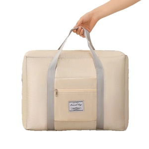 Waterproof cream quilted travel bag with grey handles and large capacity storage