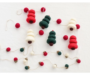 Close-up of wool felt Christmas garlands with snowman, tree, and acorn ornaments
