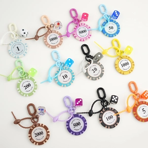 Set of 12 colorful Monte Carlo poker chip keychains with matching dice pendants