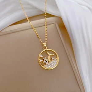 Elegant gold titanium necklace with hollow round fishtail pendant and zircon stones