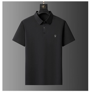 Detail of black ice silk polo shirt with TB shield embroidery and knit texture