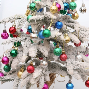 Assorted 3cm colorful electroplated Christmas balls with varied textures on snowy branches