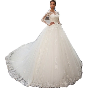 Classic ivory long sleeve ball gown wedding dress with lace appliques and cathedral train