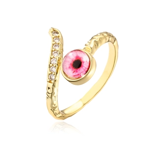 Detail of 18K gold plated open ring featuring white zircons and a pink evil eye charm