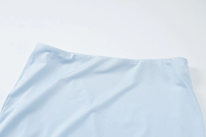 Detail shot of light blue off-shoulder top waist stitching and high-quality fabric texture