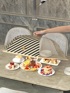 Extra large collapsible striped food cover showing a large capacity for multiple dishes