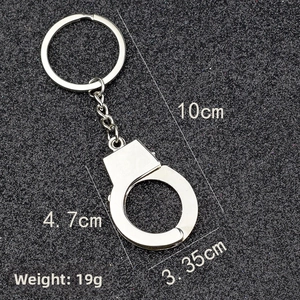 Detailed view of silver handcuffs keychain dimensions showing 10cm total length