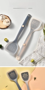 Detail of heat-resistant silicone spatulas with steel core and petal-shaped holes