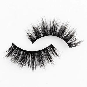 Close-up of 3D faux mink eyelashes showing thick fluffy texture and dramatic curly effect