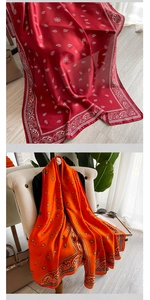 Dettaglio degli scialli in seta rossa e arancione con motivo paisley e lucentezza
