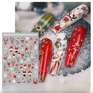 Detailed view of F889 Christmas nail stickers with Santa and reindeer on nails