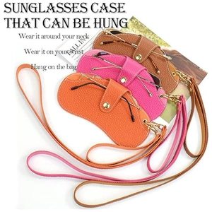 Detail of portable PU leather eyewear pouches in multiple colors with lanyard and gold button